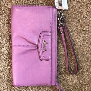 Never used purple coach wristlet!
